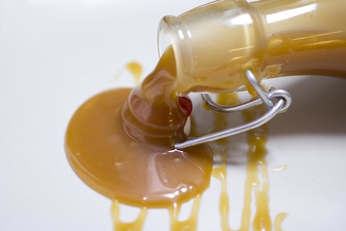 salted caramel sauce poured from bottle